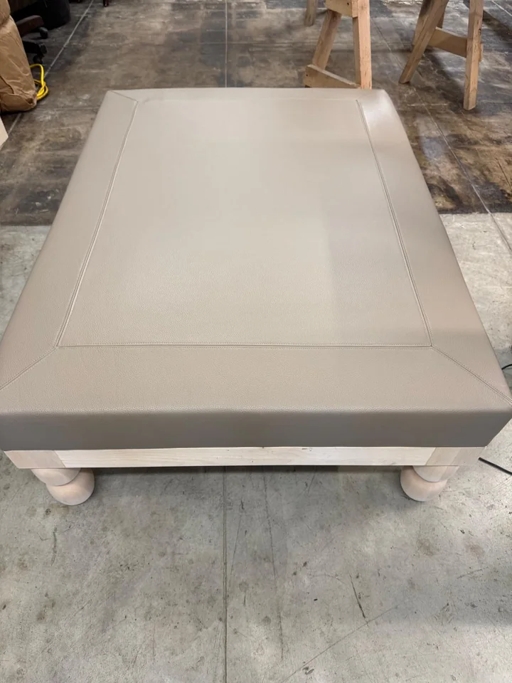 Overhead view of the ottoman’s inset rectangular stitching